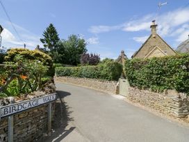 A street view with a sign for Birdcage Walk at Wyncliffe in Chipping Campden