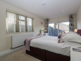 A bedroom with a bed and window at Bell Garden in Stow-On-The-Wold