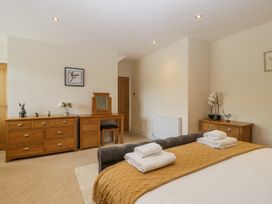 A bedroom with a bed and dresser at Bell Garden in Stow-On-The-Wold