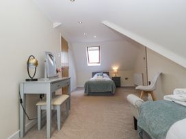 A bedroom with a bed and dresser at Bell Garden in Stow-On-The-Wold