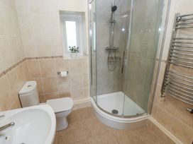 A bathroom with a shower and sink at The Old Dairy in Maenclochog