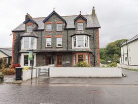 A house with multiple windows and a gate at Hazelmere in Keswick
