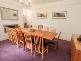 A dining room with a table and chairs at Hazelmere in Keswick