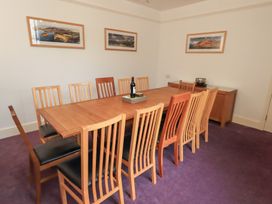 A dining room with a table and chairs at Hazelmere in Keswick