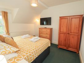 A bedroom with a bed and wardrobe at Hazelmere in Keswick