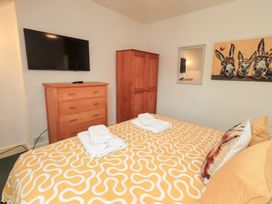 A bedroom with a bed and TV at Hazelmere in Keswick
