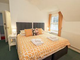 A bedroom with a bed and window at Hazelmere in Keswick
