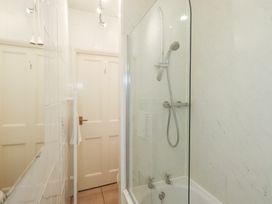 A bathroom with a shower and bathtub at Hazelmere in Keswick