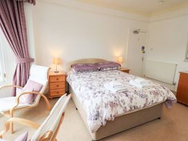 A bedroom with a bed and nightstand at Hazelmere in Keswick