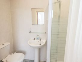 A bathroom with toilet, sink, and shower at Hazelmere in Keswick