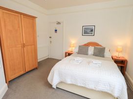 A bedroom with a bed and wardrobe at Hazelmere in Keswick
