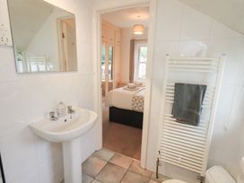 A bathroom with a sink and mirror at Hazelmere in Keswick
