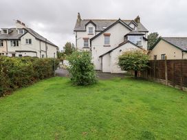 A garden with a house and fence at Hazelmere in Keswick