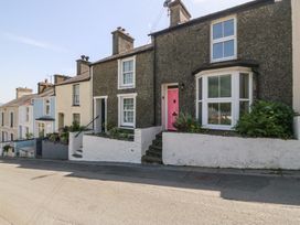 A row of houses with colored front doors at Maenllwyd Borth-Y-Gest near Porthmadog