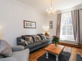 A living room with a sofa and coffee table at Charlotte House in Whitby