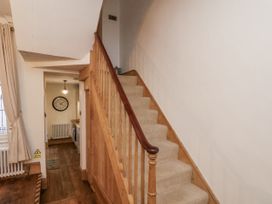 A staircase in a hallway at Charlotte House in Whitby