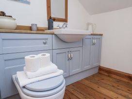 A bathroom with a sink and toilet at Charlotte House in Whitby