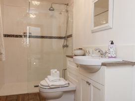 A bathroom with shower and sink at Charlotte House in Whitby