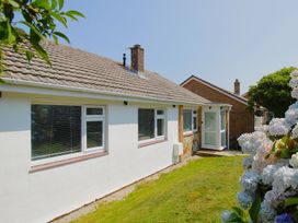 An outdoor view of a house with windows and a door at 65 Channel View Ilfracombe