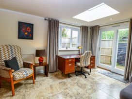 An office with a desk and chair at Birch Cottage in Brundall
