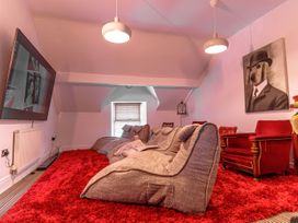 A snug with bean bag chairs and a television at Y Graiglwyd Bull Bay near Amlwch