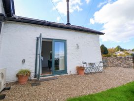 An outdoor area with a table and chairs at Cwtch in Mold
