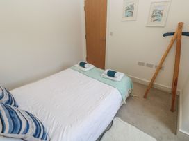 A bedroom with a bed and pillows at Upper Deck in Truro