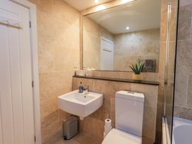 A bathroom with a sink and toilet at 8 Beechwood Close Bowness-On-Windermere