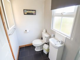 A bathroom with a toilet and sink at Angel's Retreat in Huttoft