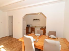 A dining room with a table and chairs at Bracken Cottage St Tudy