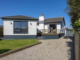 A house with a deck and gravel driveway at 38 Venn Park Stoke Fleming