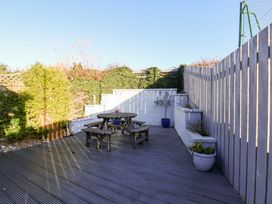 A garden with a table and benches at Pond Farm View in Hinderwell