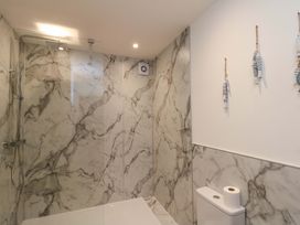 A bathroom with a shower and toilet at Apartment 1, 19 Cleveland Terrace in Whitby