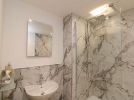 A bathroom with shower and sink at Apartment 1, 19 Cleveland Terrace in Whitby