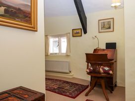 An office with a desk and chair at Fox Hat Cottage in Chagford