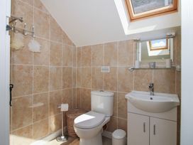 A bathroom with a sink and toilet at Buzzards Breg in Builth Wells