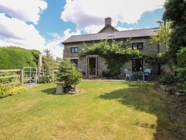 A house with a garden and seating area at Buzzards Breg in Builth Wells