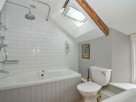 A bathroom with a bathtub and shower at Island House in Golant near Tywardreath