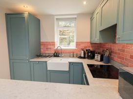 A kitchen with cabinets, sink, and appliances at West View, Leasgill near Milnthorpe