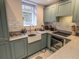 A kitchen with a sink and appliances at West View Leasgill near Milnthorpe