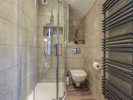A bathroom with a shower and toilet at West View in Leasgill near Milnthorpe