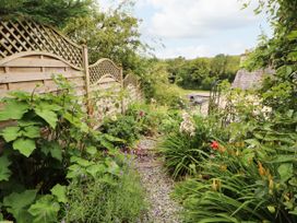 A garden with a pathway and plants at West View in Leasgill near Milnthorpe