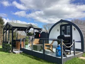 An outdoor area with furniture and barbecue at Cherry Pod Hookagate near Meole Brace