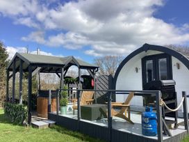 An outdoor area with gazebo and grill at Cherry Pod Hookagate near Meole Brace
