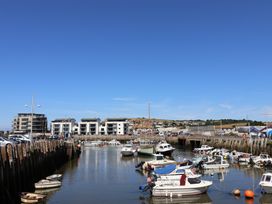 A harbor with boats and buildings at Flat F