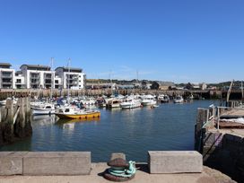 A harbor with boats and buildings at Flat F 