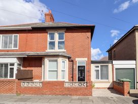 A brick house with windows and a front door at Lobster Pot Retreat Newbiggin-By-The-Sea