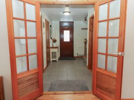 A hallway with double doors and a console table at Summerseat in Kirkby Stephen