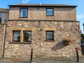 A building with windows and a flower pot at Summerseat in Kirkby Stephen
