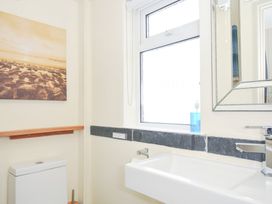 A bathroom with a sink and toilet at Beachside in Polzeath